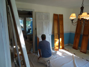 Laying off interior door with a painter's brush
